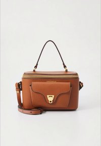 Brown leather handbag with gold zipper and clasp, front pocket, and detachable shoulder strap; features a top handle for carrying.