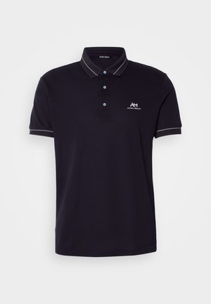 Navy polo shirt made of cotton, featuring a two-button collar, short sleeves with white accents, and a logo on the left chest.