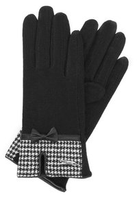 Guanti neri realizzati in materiale morbido, con un polsino a motivi houndstooth, un dettaglio a fiocco nero e un design elegante.