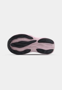 Shoe sole featuring a sculpted design, primarily in light pink with black accents. Textured rubber for enhanced grip and flexibility.