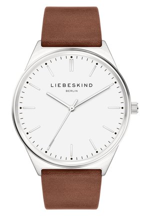 Brown leather strap watch with a silver case, white dial, slim hour markers, and silver hands. Brand name "LIEBESKIND BERLIN" displayed.