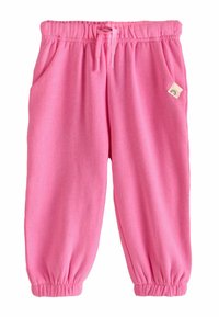 Rózsaszín gyermeknadrág, elasztikus derékrésszel, zsinórral, oldalsó zsebekkel, elasztikus mandzsettákkal, és egy kis szivárványos folttal a jobb zsebén.