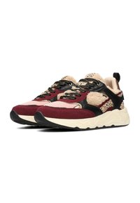 Chunky sneakers with burgundy, black, and pink panels; textured fur accents; gold hardware; and a thick white midsole with black outsole.