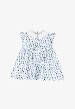Robe blanche avec imprimé floral bleu, manches courtes à volants et col Peter Pan. Fermeture à boutons dans le dos. Tissu en coton doux.