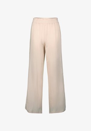 Jasnobeżowe spodnie o szerokich nogawkach z elastycznym paskiem w talii i miękką, gładką fakturą. Brak widocznych wzorów lub detali metalowych.