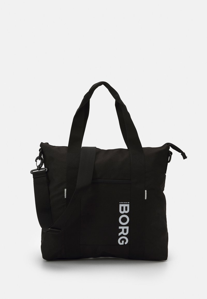 Saco de tecido preto com alças duplas, correia de ombro ajustável e um bolso frontal com fecho, apresentando o texto branco "BORG".