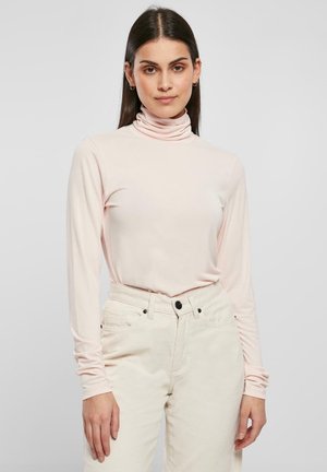 Lichtroze lange mouwen turtleneck shirt, gemaakt van zachte stof; heeft een aansluitend ontwerp met een gladde textuur en opgerolde kraag.