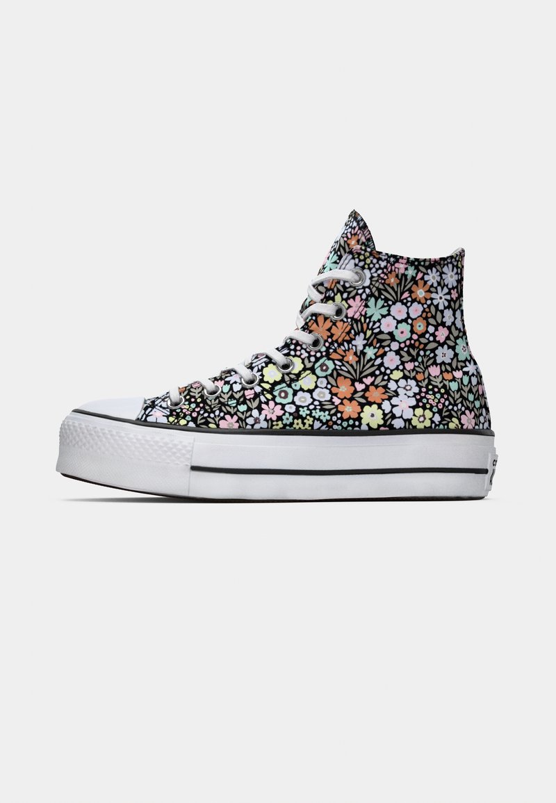 Baskets montantes avec un imprimé floral dans des couleurs pastel sur un fond noir, semelle en caoutchouc blanc et lacets blancs. Tige en tissu texturé.