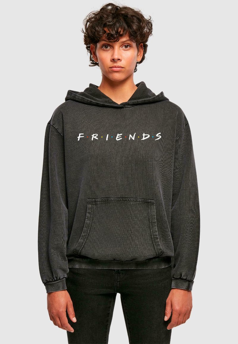Czarna bluza z kapturem z białym logo "FRIENDS" i kolorowymi kropkami, z kieszenią na przodzie oraz ściągaczami na rękawach, wykonana z teksturowanej tkaniny.