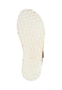 Zool van een schoen met een textuur op de witte rubberen onderkant, voorzien van geometrische loopvlakpatronen en een klein merklabel nabij de hiel.