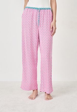 Pantalons de pyjama roses avec un motif graphique répété, coupe ample, taille élastique avec un cordon turquoise et une texture douce.