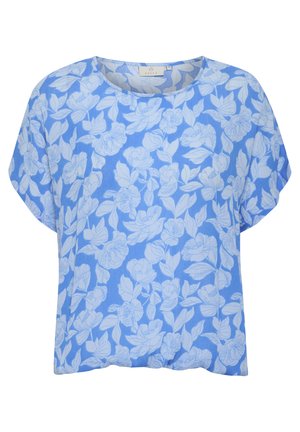 Blouse bleu clair avec un motif floral blanc. Tissu doux avec une coupe décontractée et des manches courtes. Encolure ronde sans attache.