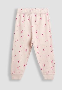 Lichtroze katoenen broek met een elastische tailleband en elastische boorden, voorzien van een bloemenpatroon in tinten van roze en wit.