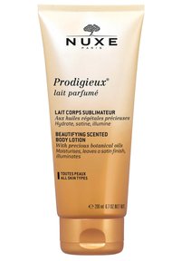 Lotion corpo Prodigieux di Nuxe in un tubo squeeze dorato, con testo nero e logo di un albero, con una capacità di 200 ml e adatta a tutti i tipi di pelle.