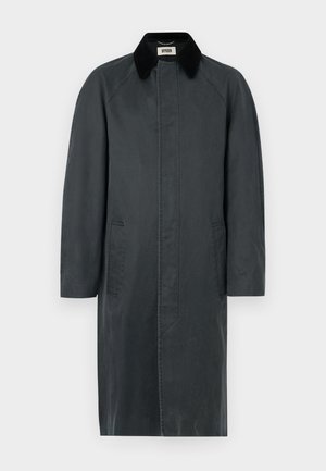 Long black coat made from a matte fabric, featuring a contrasting collar, two side pockets, and a straight silhouette.