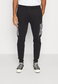 Kings Will Dream AXEL JOGGER - Calças de fato de treino - jet black