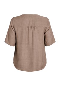 Short-sleeve, brown linen blouse featuring a rounded neckline, pleat detail at the back, and a relaxed fit.