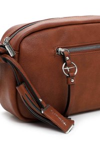 Brown leather crossbody bag featuring a zippered main compartment, a front zip pocket, and a decorative strap with silver hardware accents.