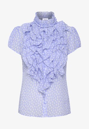 Világoskék, rövidujjú blúz fodros elülső résszel, fehér szívmintázattal. Az anyag puha, áttetsző hatású.