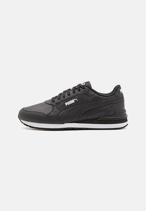 Black Puma sneaker with white logo, laces, and midsole, featuring textured leather upper and rubber outsole on a white background.