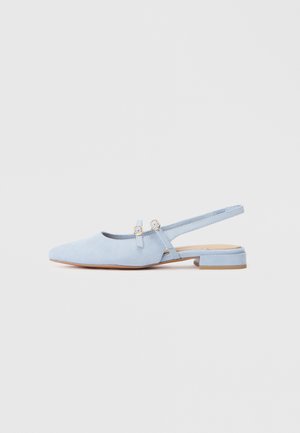 Light blue suede slingback shoe with flat heel, pointed toe, and dual straps featuring gold-tone hardware accents.