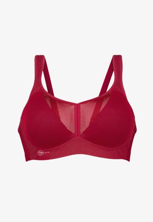 Punainen verkkomallinen urheiluliivi, jossa on leveät olkaimet, rakenteellinen muoto ja pyöreä pääntie. Mukana logo-yksityiskohta vyötäröllä.