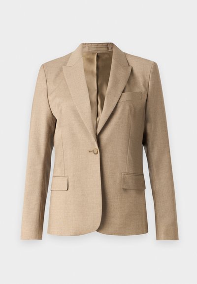 Bež bleiser, millel on sakiline krae, üks nupp sulgemiseks ja kaks esist taskut. Tekstureeritud kangas, millel on sile sisemine vooder.