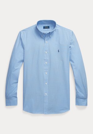 Svetlo modra in bela karo srajca z dolgimi rokavi, gumbi in ovratnikom z gumbi ter majhno vezeno logo Polo na prsih.
