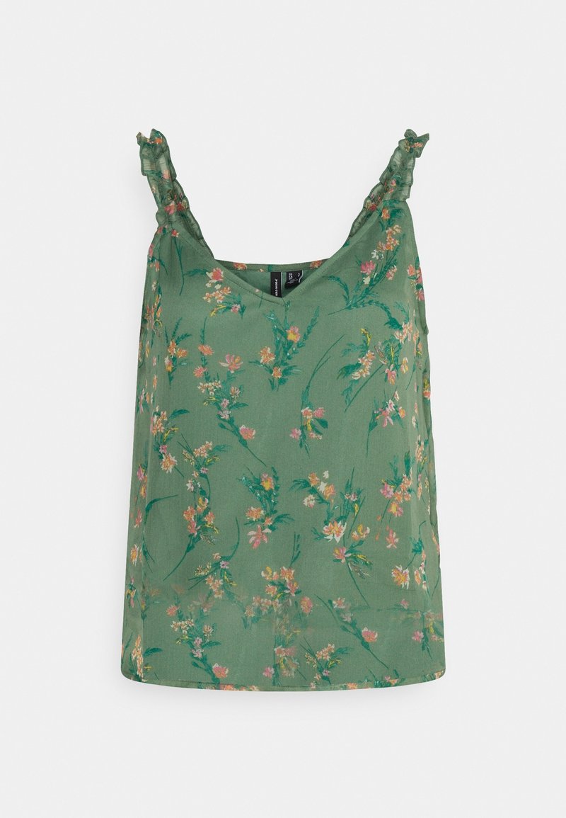 Grüne ärmellose Bluse mit dünnen Rüschenträgern und einem rosa und gelben Blumenmuster auf einem hellen Hintergrund.