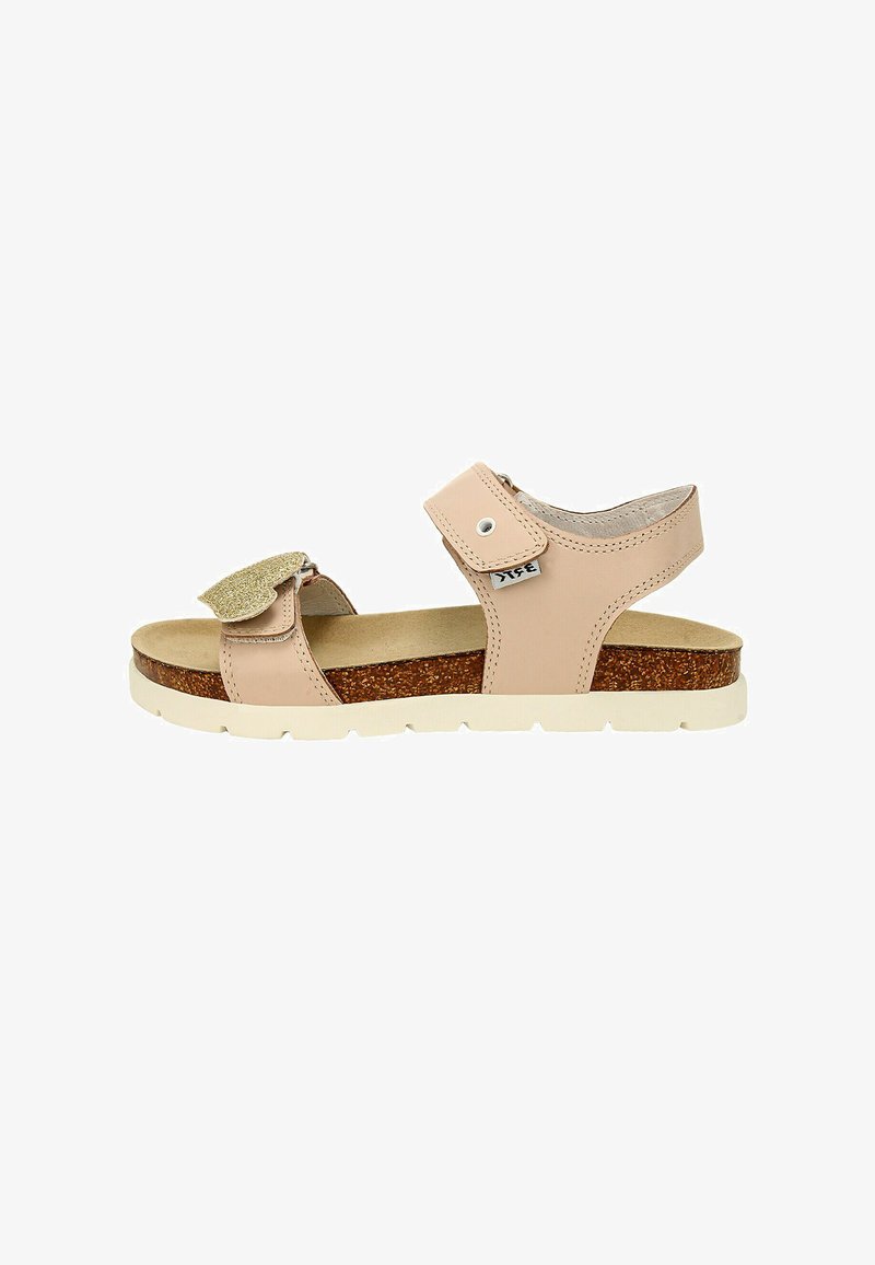 Tan leather sandal with cork midsole, white rubber outsole, velcro strap, and sparkly accent on the strap. Open-toe design.