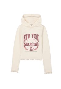 Sudadera con capucha de color crema que presenta un texto gráfico rojo que dice "NUEVA YORK" con un diseño de laurel y un dobladillo superior ondulado.