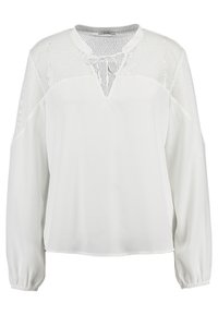 Vit långärmad blus med texturerad infällning, V-ringning och draperade ärmslut. Slät tyg med ett lätt och luftigt utseende.