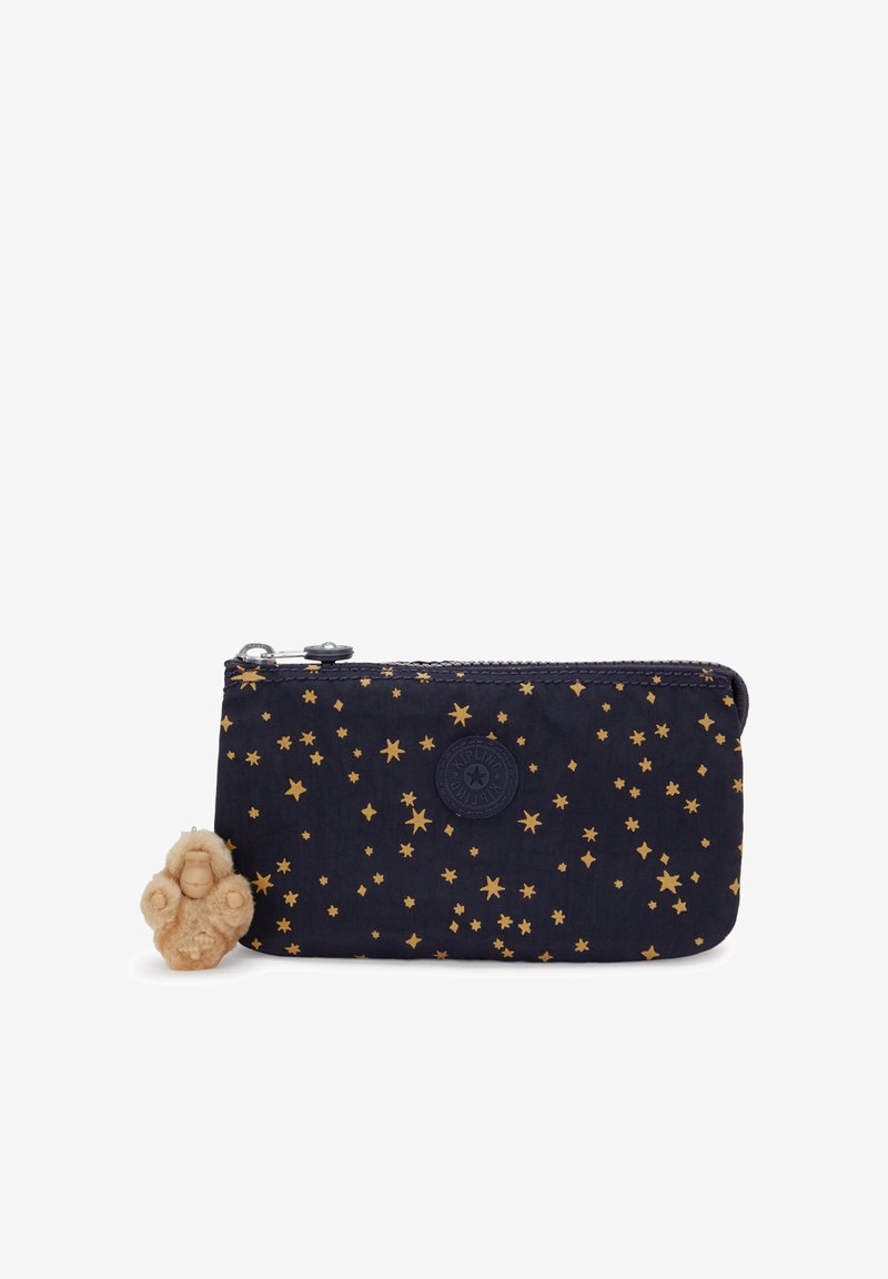 Navy fabric wallet with gold star pattern, zip closure, and logo emblem. Includes a tan decorative charm in a seated position.