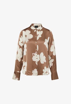 Bruine satijnen blouse met lange mouwen, knoopsluiting, grote witte bloemenprint en spitse kraag.