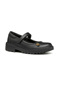 Chaussures Mary Jane en cuir noir avec une bande velcro, semelle texturée et petit accent doré. Dotées d'un bout arrondi et d'une plateforme solide.