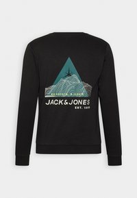 Sweat-shirt noir à manches longues avec un graphique en fil de fer représentant une montagne, un triangle bleu, une boussole, et le texte "JACK & JONES EST. 1990" dans le dos.