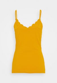 Gul linne med scallopad halsringning, tunna justerbara band och en tajt design. Tillverkad av ett mjukt, elastiskt tyg.