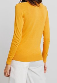 Dorothy Perkins Neuletakki - dark yellow