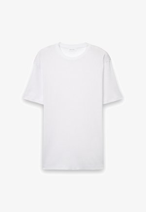 White ribbed cotton T-shirt with short sleeves, round neckline, and no visible patterns or graphics. Smooth texture with a relaxed fit.