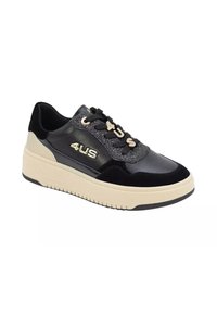 Sneaker nere e beige con tomaia in pelle liscia, dettagli glitterati e design con allacciatura, dotata di suola spessa. Logo visibile di lato.