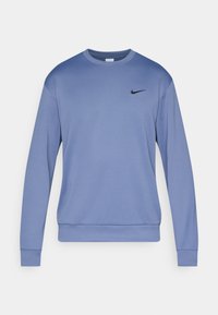 Sweatshirt en polaire bleu avec des manches longues, un col rond, des poignets et une taille côtelés. Il dispose d'un petit logo Nike noir sur la poitrine.