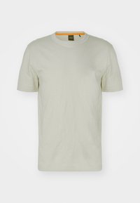Helle graue kurzärmelige T-Shirt aus weichem Stoff mit rundem Halsausschnitt. Verfügt über ein kleines, dezentes Logo auf der Brust und orangefarbene Besätze innen.