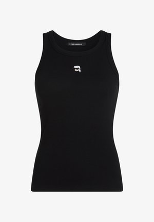 Μαύρο ριμπ αμάνικο τοπ με μικρό κεντημένο πρόσωπο που φορά γυαλιά ηλίου, τοποθετημένο στο κέντρο κάτω από το λαιμόκοψη.