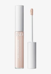 Correcteur mat léger dans un tube transparent avec des accents blancs. Baguette applicatrice incluse, remplie d'un produit beige doux et crémeux.