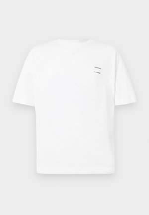 White cotton t-shirt with a relaxed fit, short sleeves, and a V-neck. Features two small black printed logos on the left side.
