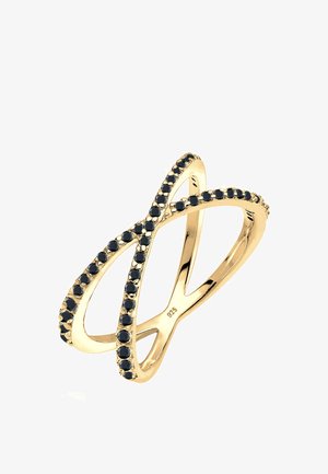 Bague en or avec un design entrelacé, ornée de petites pierres noires le long des bords. Marquée "925" à l'intérieur pour l'argent sterling.