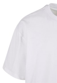 White cotton t-shirt featuring short sleeves, a crew neckline, and a smooth, soft texture. No visible patterns or accents.
