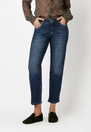 Dunkelblaue Jeans aus Denim mit geradem Bein, subtilen Verbleichungen, mittlerer Taille und klassischem Fünf-Taschen-Design.
