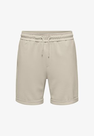Shorts décontractés beige avec taille élastique, cordon de serrage, poches latérales et ourlet retroussé.