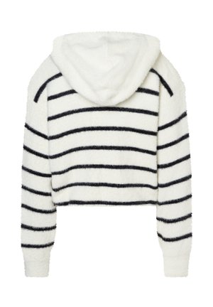 Gestreifter kurzer Hoodie aus flauschigem weißen und schwarzem Material, mit Kapuze, langen Ärmeln und horizontalen schwarzen Streifen.